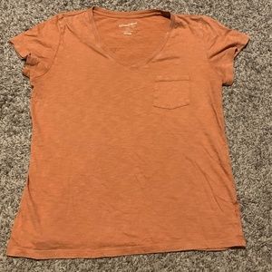 Small brown-orange women's v-neck t-shirt.